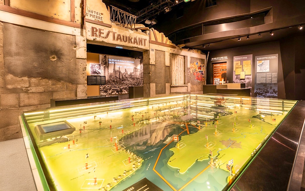Interactive map display at Caen Memorial Museum showcasing D-Day landings.