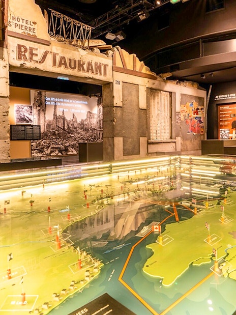 Interactive map display at Caen Memorial Museum showcasing D-Day landings.