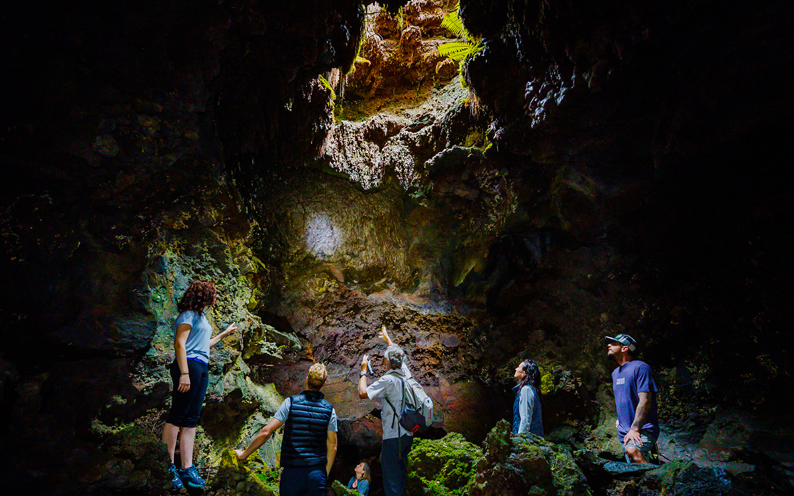 Guests exploring inside Hualalai Volcano on the Hidden Craters Hike.