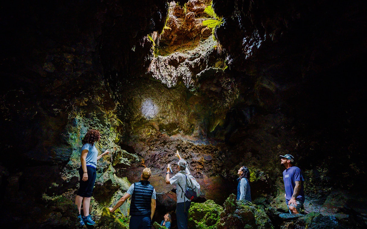 Guests exploring inside Hualalai Volcano on the Hidden Craters Hike.