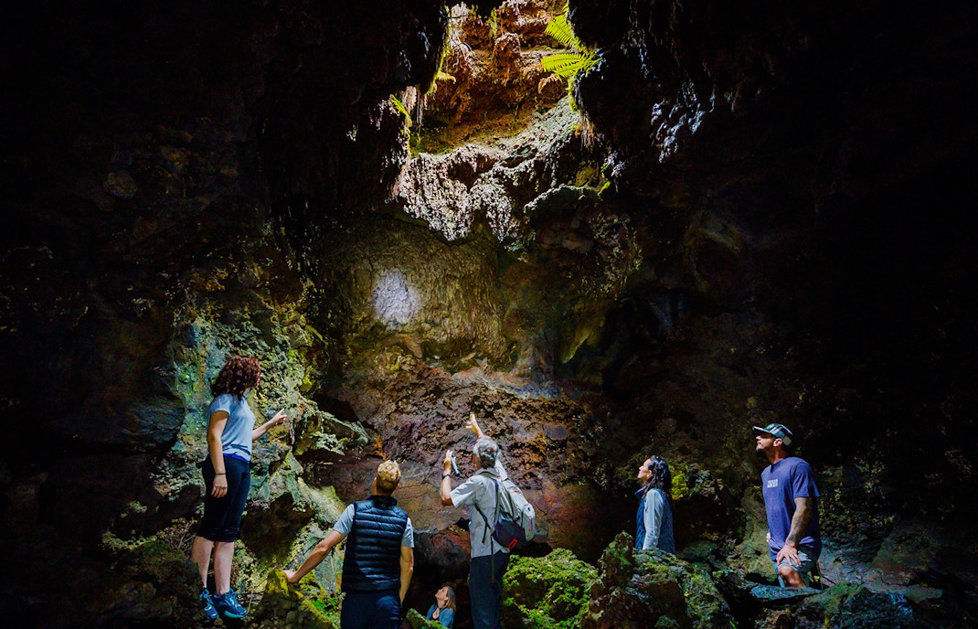 Guests exploring inside Hualalai Volcano on the Hidden Craters Hike.