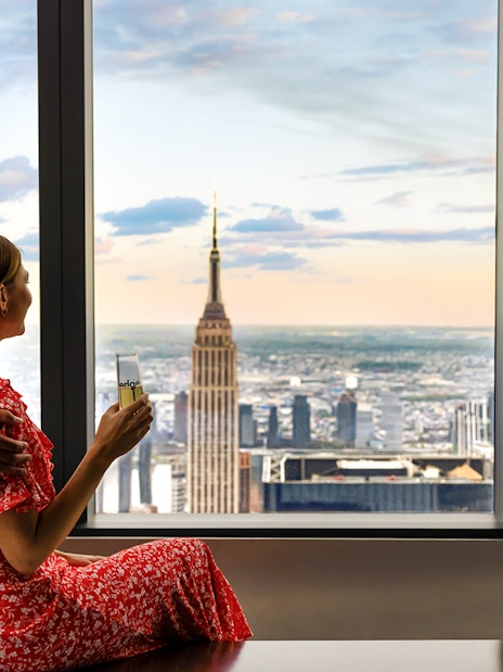 Couple enjoying view of New York City skyline from Edge Observation Deck.