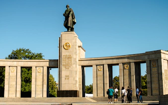 Soviet War Memorial in Berlin with tourists on a walking tour.