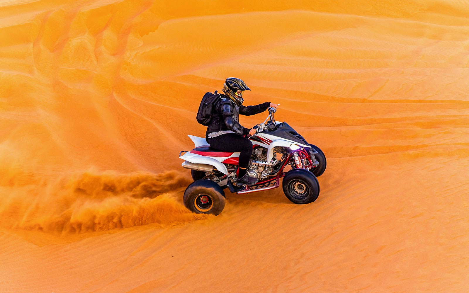 Quad bike adventure in Dubai desert with sand dunes in the background