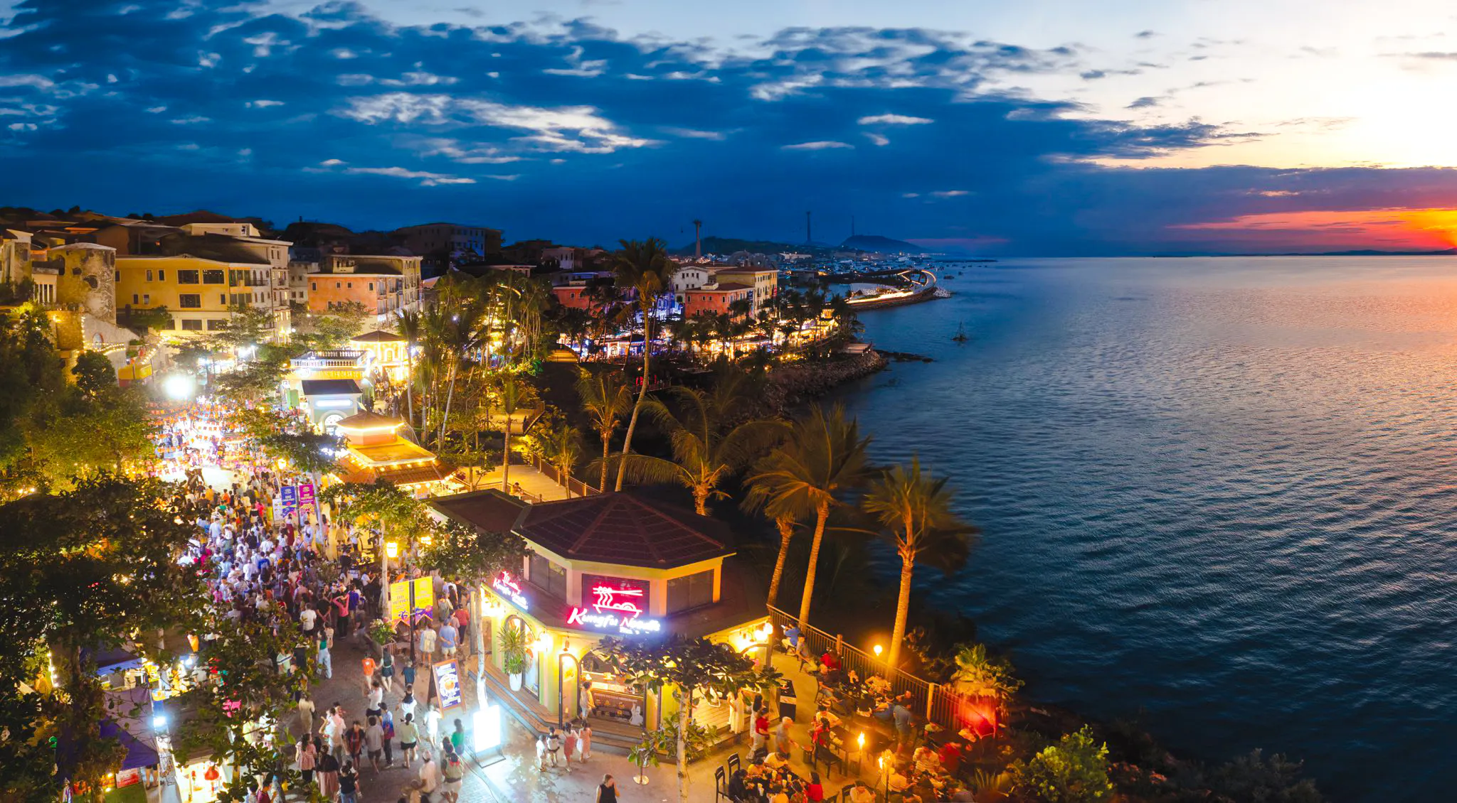 Crowded evening street market near the coast during Phu Quoc Sunset Tour.