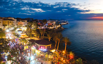 Crowded evening street market near the coast during Phu Quoc Sunset Tour.