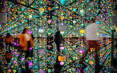 Guests exploring colorful digital exhibits at Signal Space Digital Art Gallery.