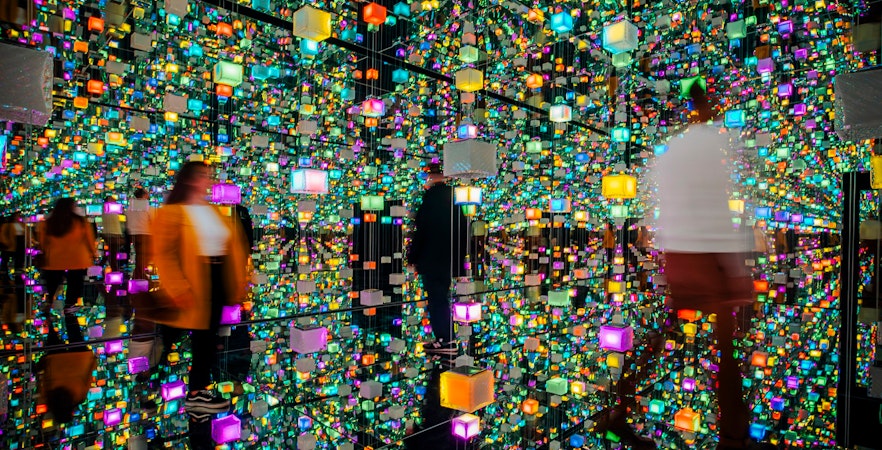 Guests exploring colorful digital exhibits at Signal Space Digital Art Gallery.