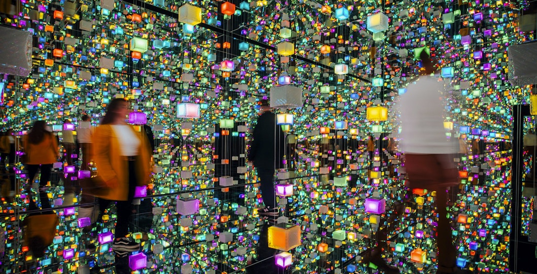 Guests exploring colorful digital exhibits at Signal Space Digital Art Gallery.