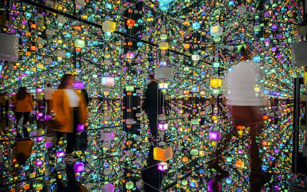 Guests exploring colorful digital exhibits at Signal Space Digital Art Gallery.