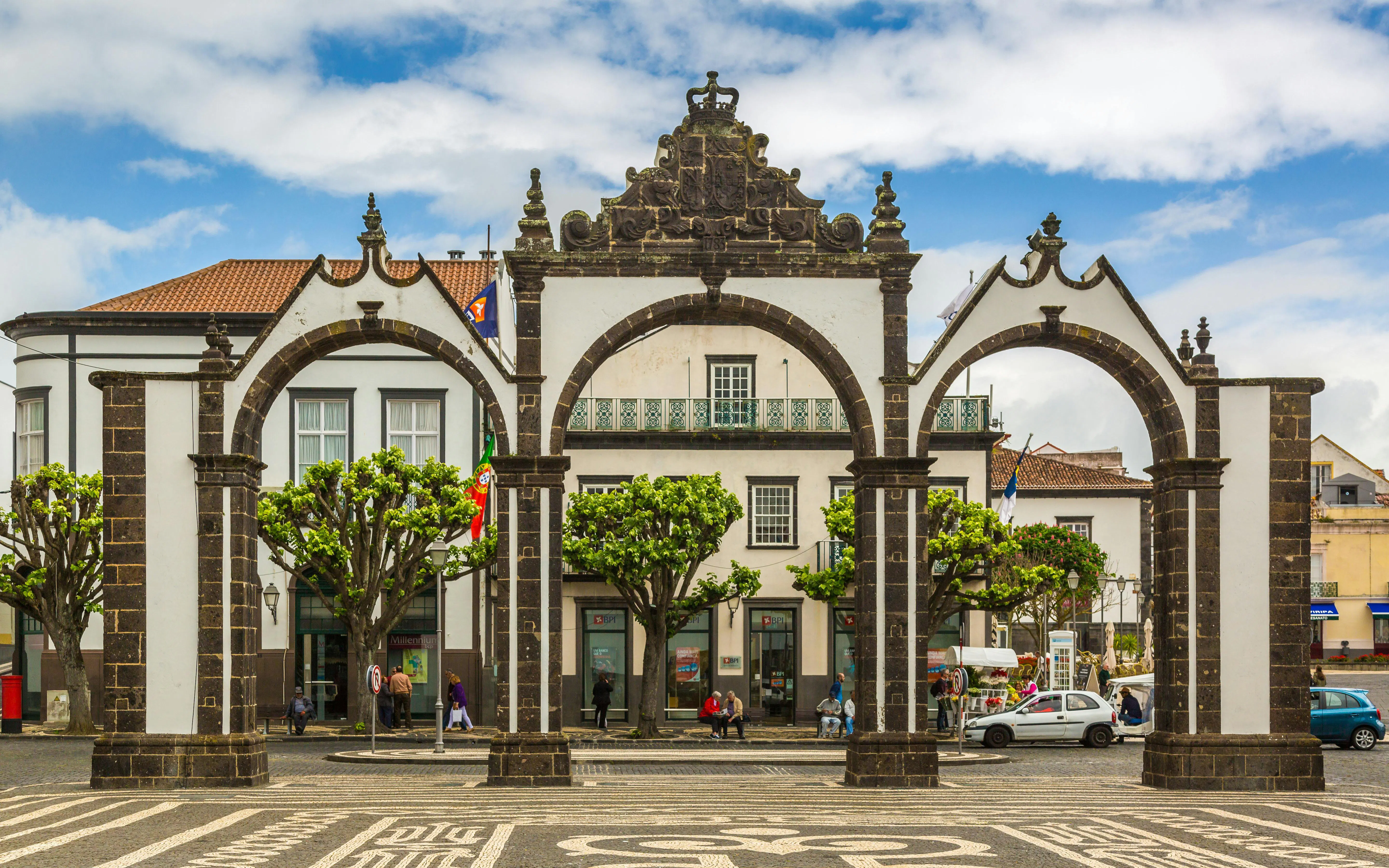 Portas da Cidade arches in Ponta Delgada, Azores with surrounding buildings.