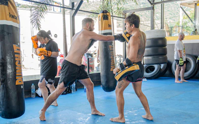 Muay Thai beginners practicing punches in a Koh Samui boxing class.