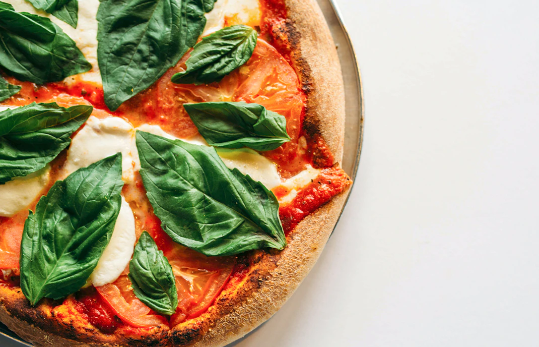 Pizza with fresh basil and mozzarella from a cooking class in Florence.
