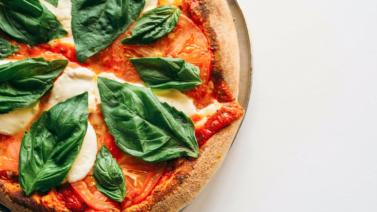 Pizza with fresh basil and mozzarella from a cooking class in Florence.