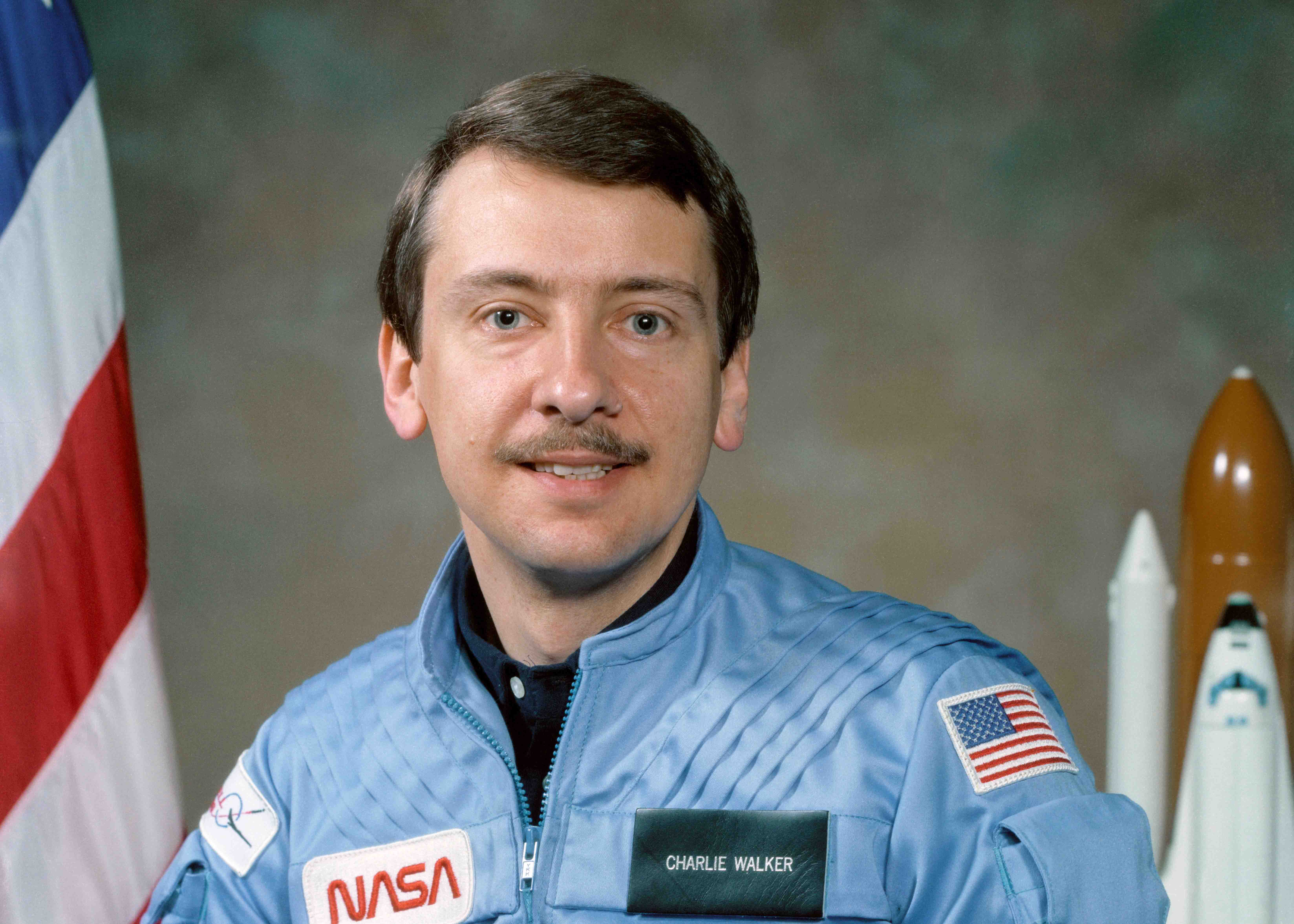 Charlie Walker against a backdrop for a photograph.