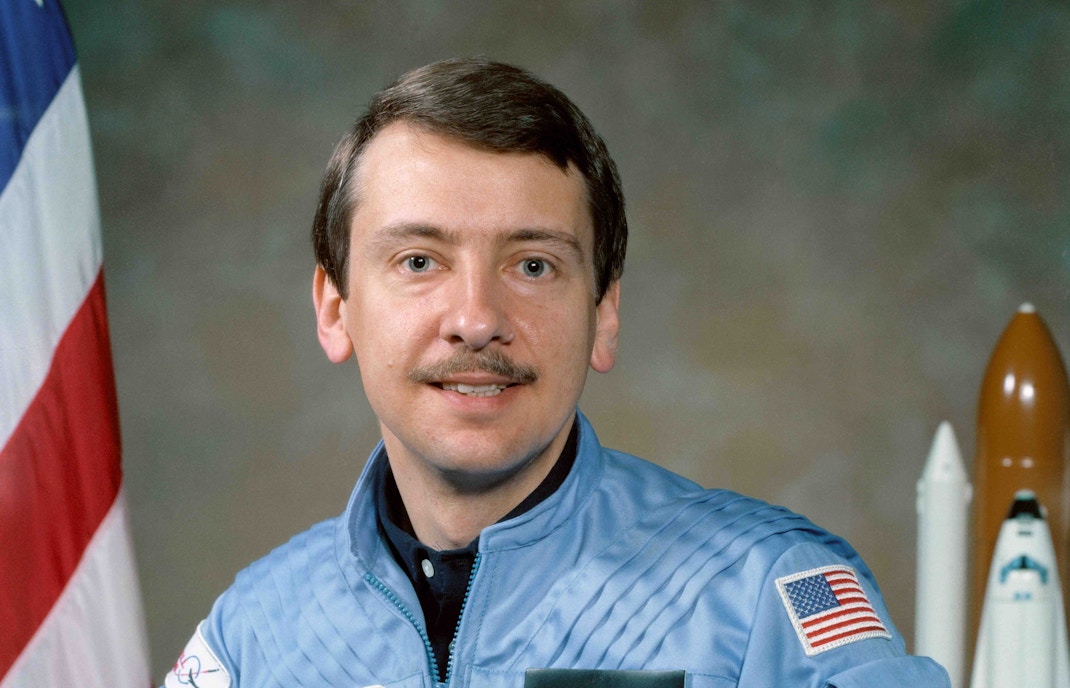 Charlie Walker against a backdrop for a photograph.