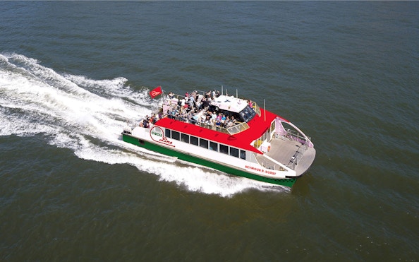 Circle Line boat on Liberty Super Express tour in open water.