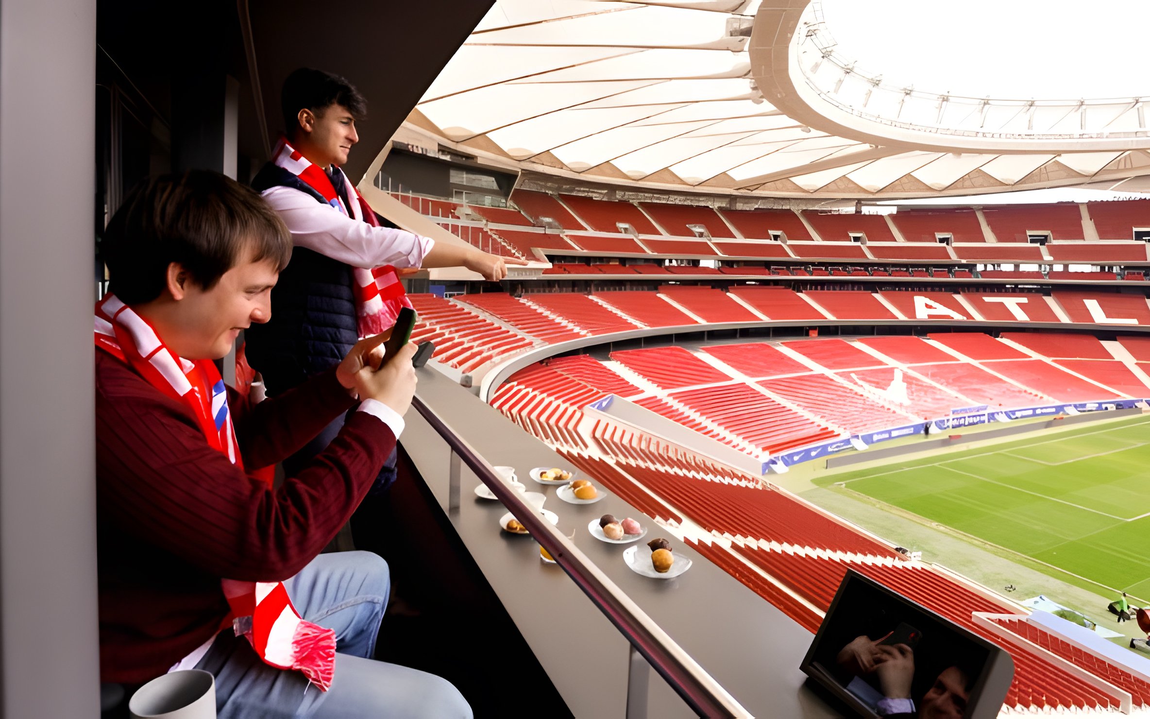 Tourists enjoying lunch while viewing Atlético de Madrid stadium from Simeone's Private Box.
