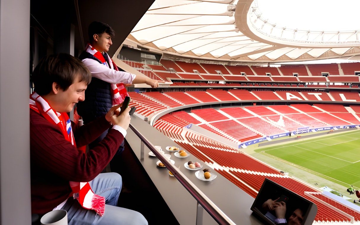 Tourists enjoying lunch while viewing Atlético de Madrid stadium from Simeone's Private Box.