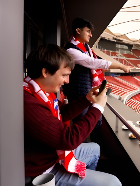 Tourists enjoying lunch while viewing Atlético de Madrid stadium from Simeone's Private Box.