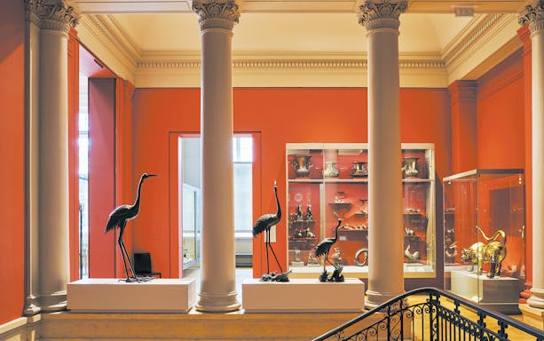 Interior of Cernuschi Museum in Paris with sculptures and artifacts displayed.