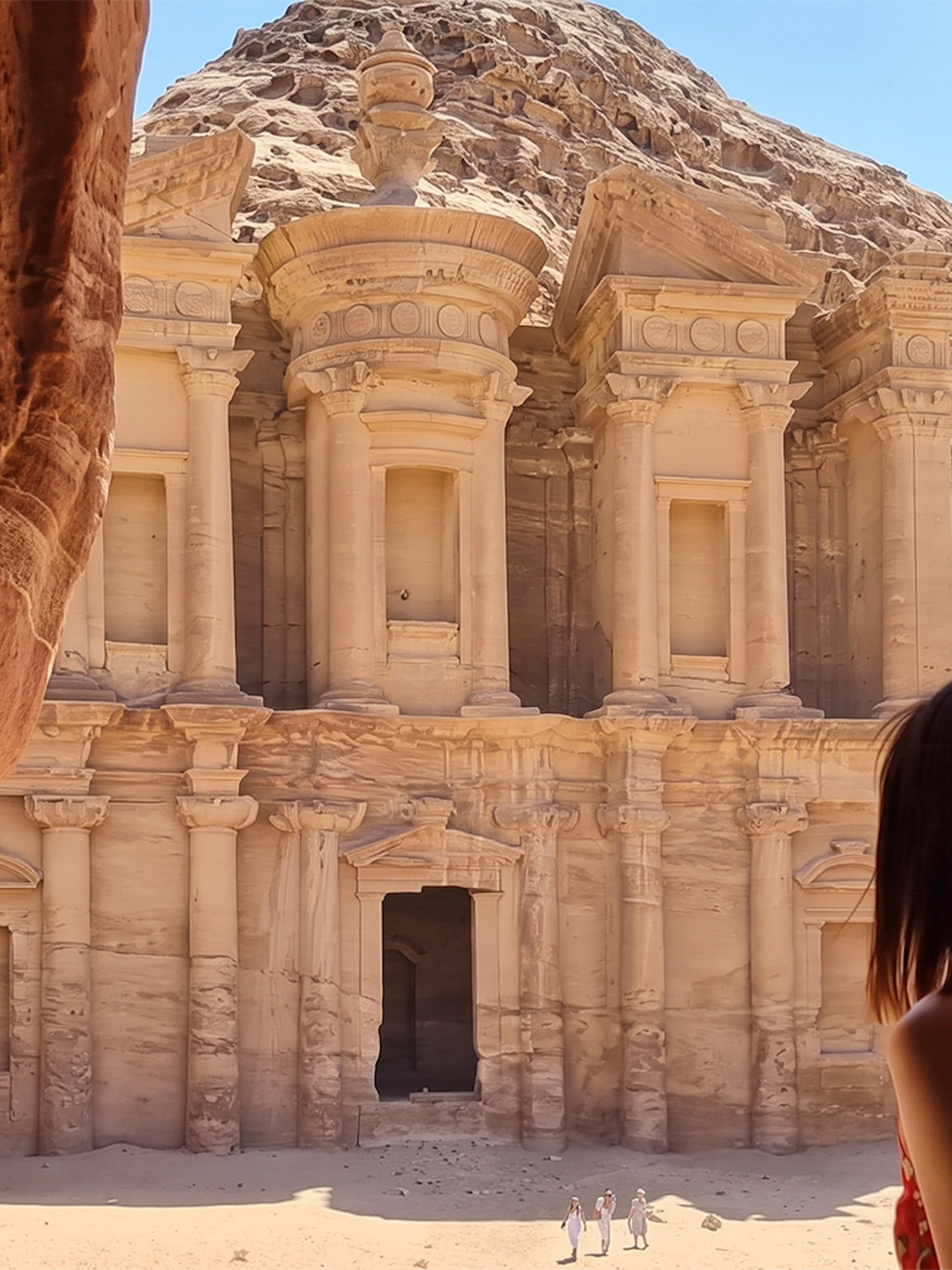 Petra's Al-Deir Monastery viewed from a cave, part of a 2-day tour from Amman.