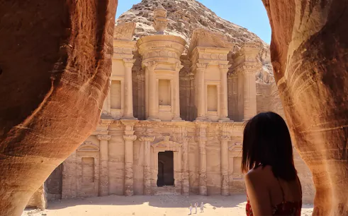 Petra's Al-Deir Monastery viewed from a cave, part of a 2-day tour from Amman.