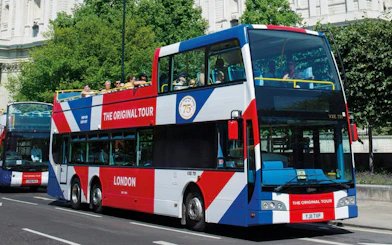 Hop-on hop-off double-decker bus on London street, part of the Original Tour.