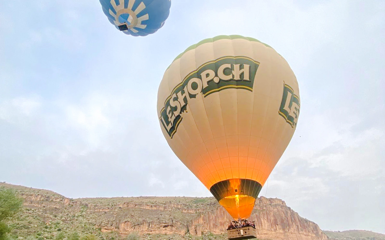 Hot air balloons flying over Ihlara Valley, Cappadocia during a scenic ride.