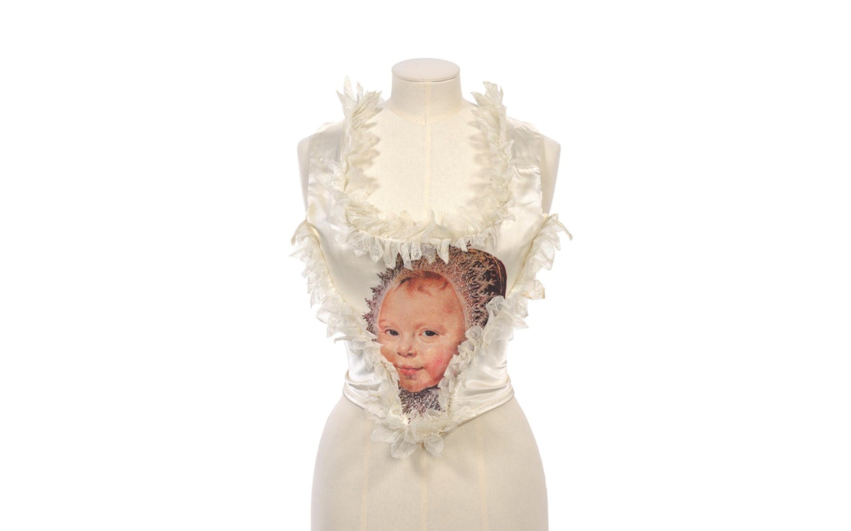 Kawakubo design with child portrait at NGV Westwood exhibition.