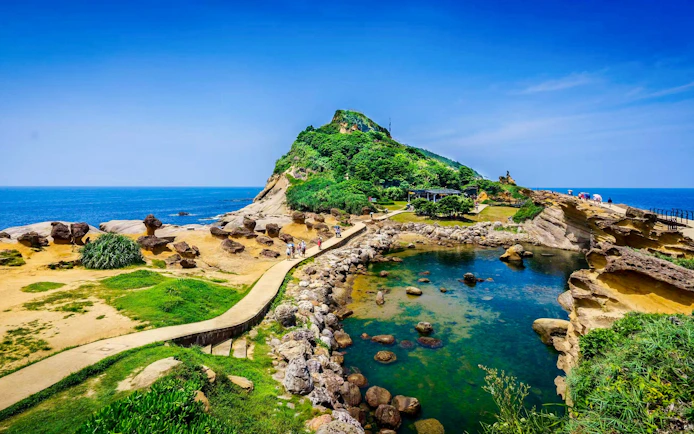 Coastal rock formations and pathways at Yehliu Geopark, New Taipei City, Taiwan.