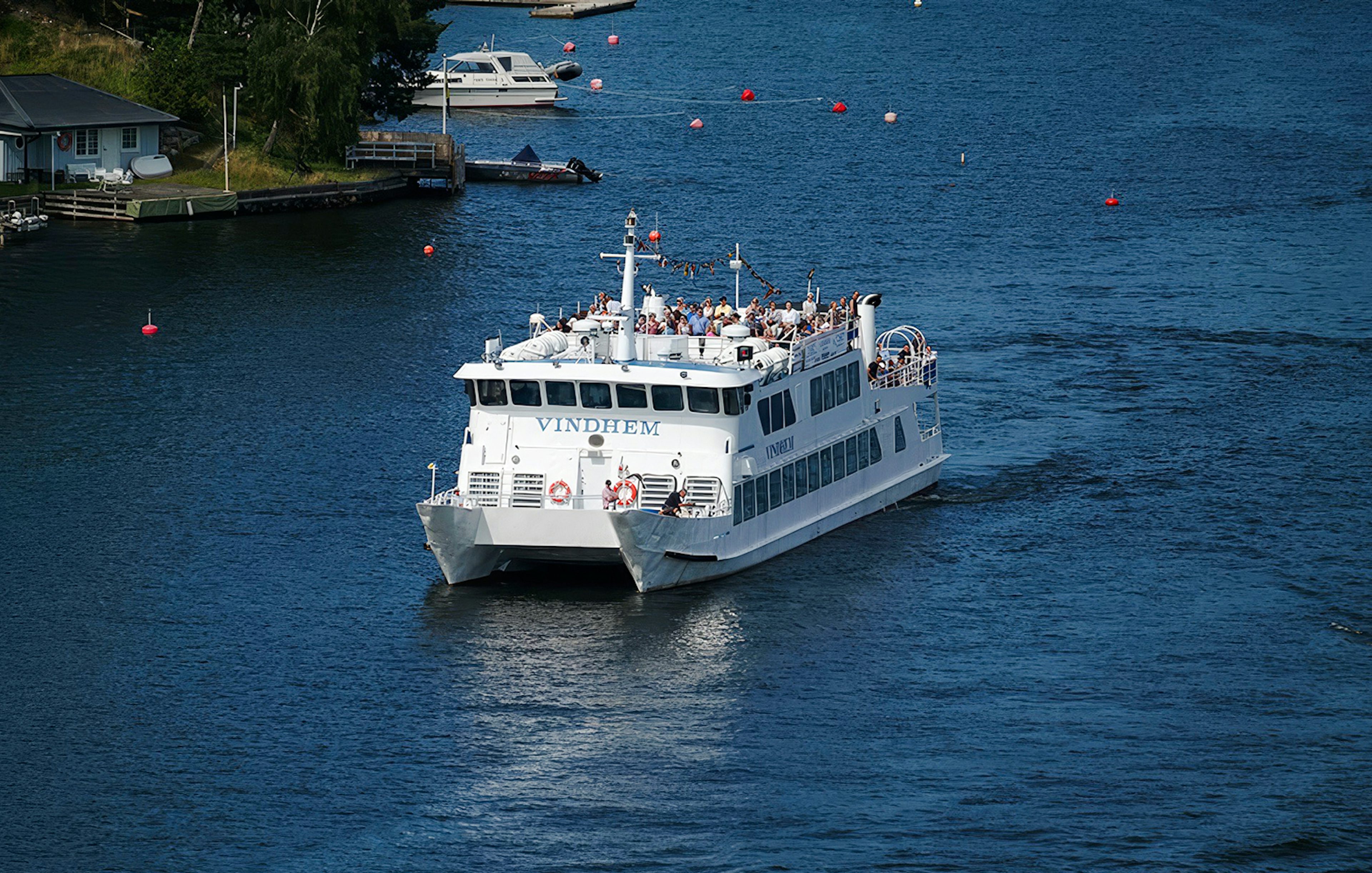 Ferry cruising through Stockholm archipelago, part of Swedish Fika tour.