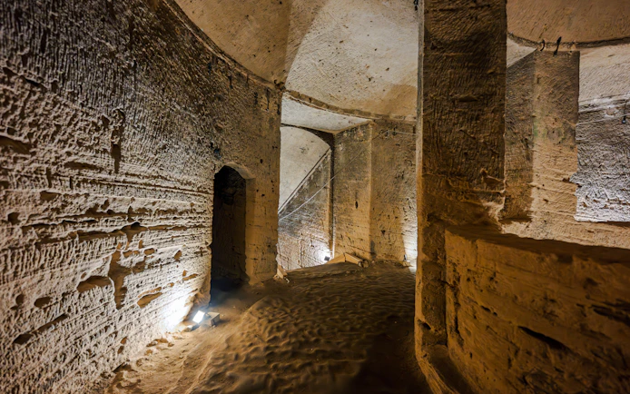 Inside view of ancient stone corridors in the Catacombs of Kom el Shoqafa, Alexandria, Egypt.