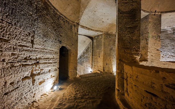 Inside view of ancient stone corridors in the Catacombs of Kom el Shoqafa, Alexandria, Egypt.