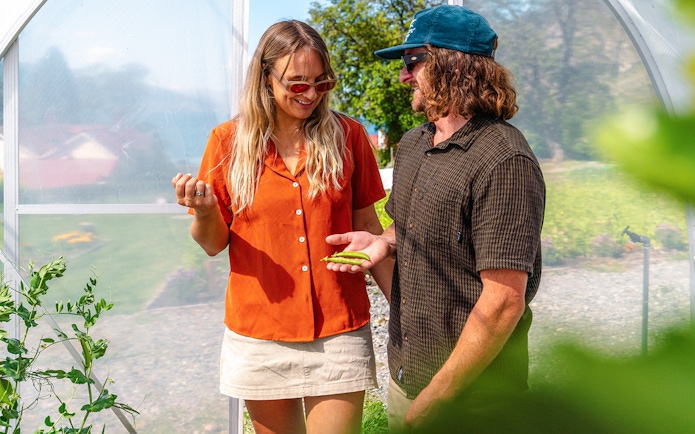 Tourists exploring greenhouse at Walter Peak High Country Farm.