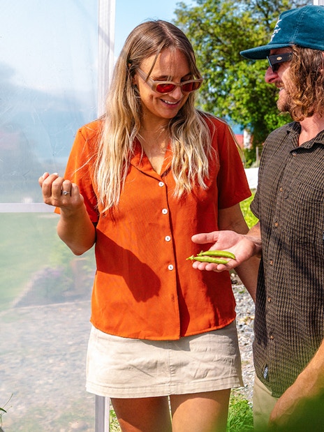 Tourists exploring greenhouse at Walter Peak High Country Farm.