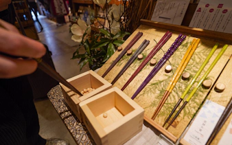 Chopsticks and wooden boxes in a Tokyo shop, part of the Samurai Experience tour.