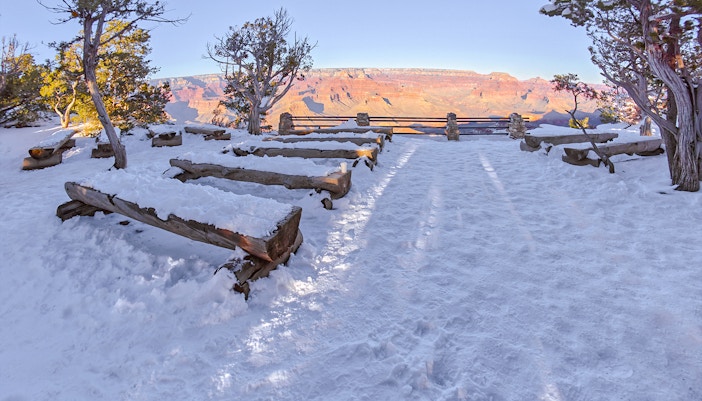 winter scene at Yavapai Point Amphitheater overlooking the Grand Canyon's vast landscape.