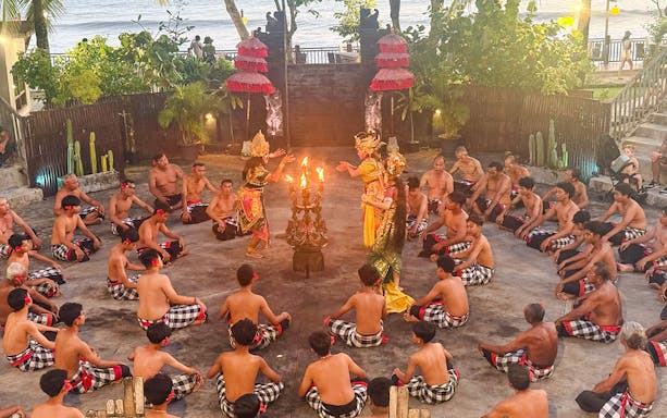 Performers chant around dancers during Kecak & Fire Dance at Tanah Lot temple.