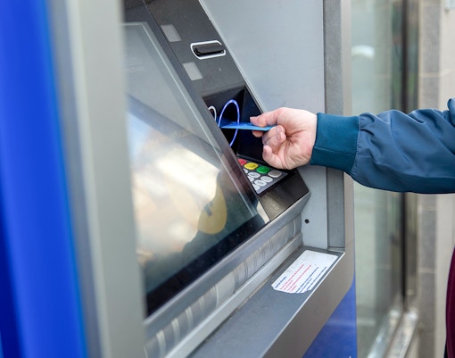Man withdrawing from an ATM machine
