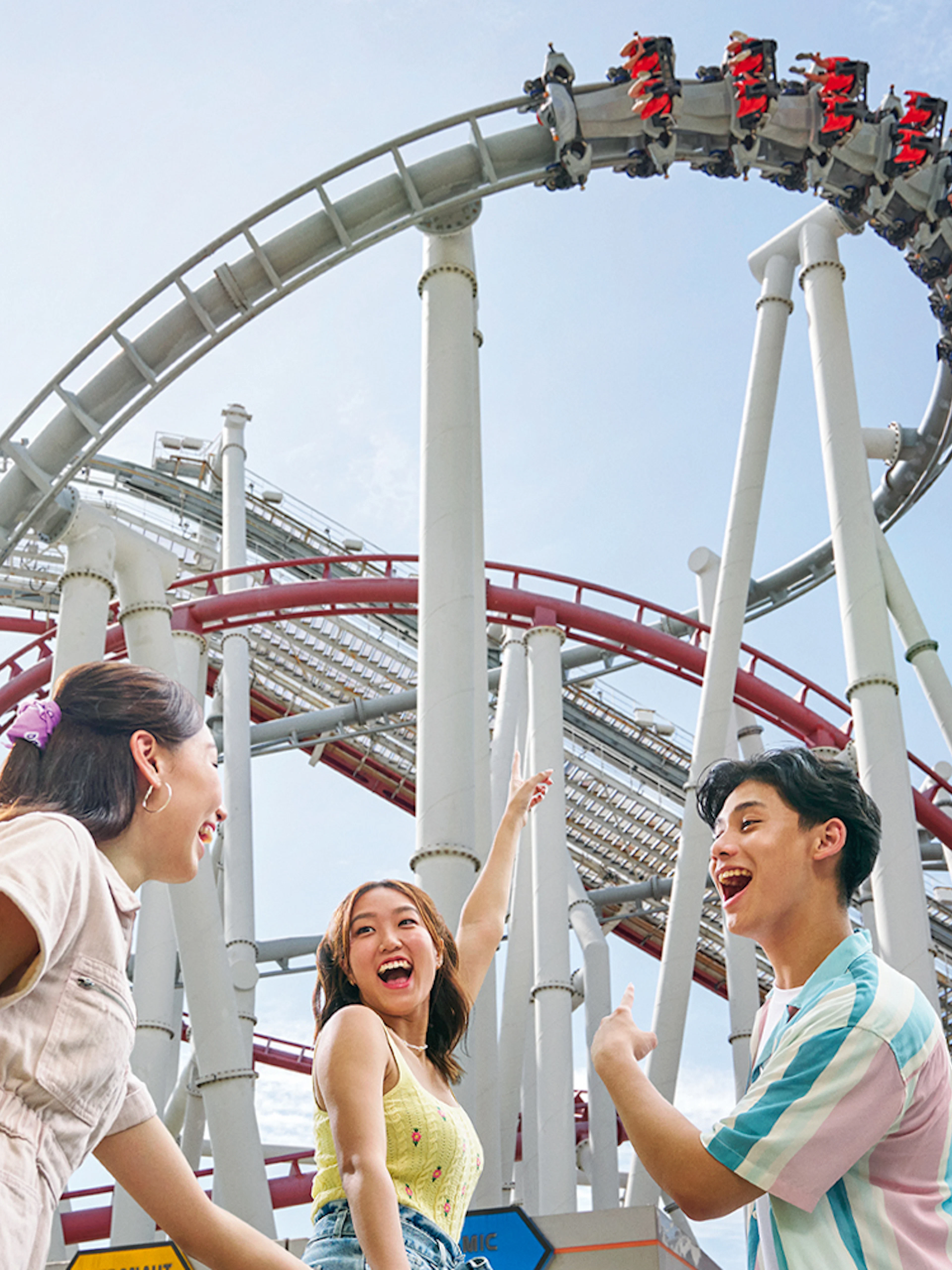 Family enjoying a roller coaster at Universal Studios Singapore.