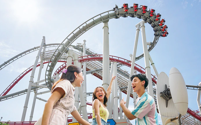 Family enjoying a roller coaster at Universal Studios Singapore.