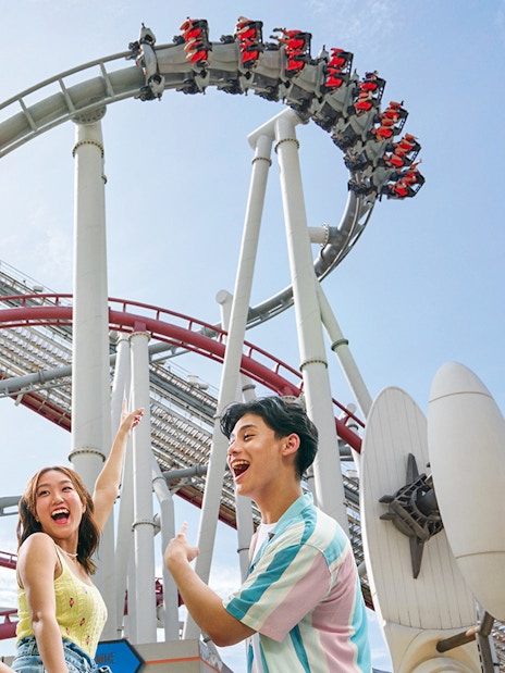 Family enjoying a roller coaster at Universal Studios Singapore.