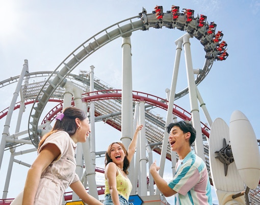 Family enjoying a roller coaster at Universal Studios Singapore.