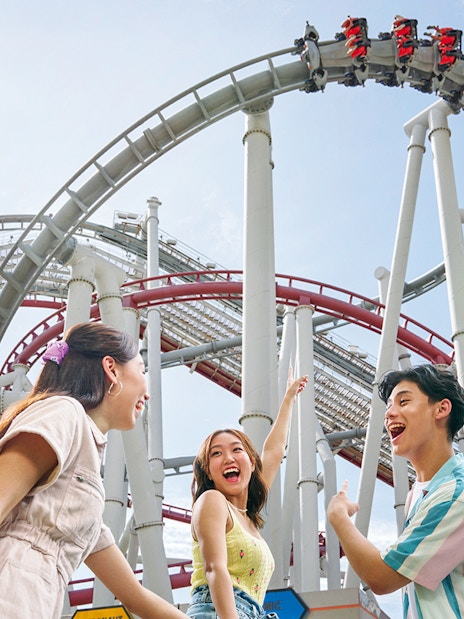Family enjoying a roller coaster at Universal Studios Singapore.