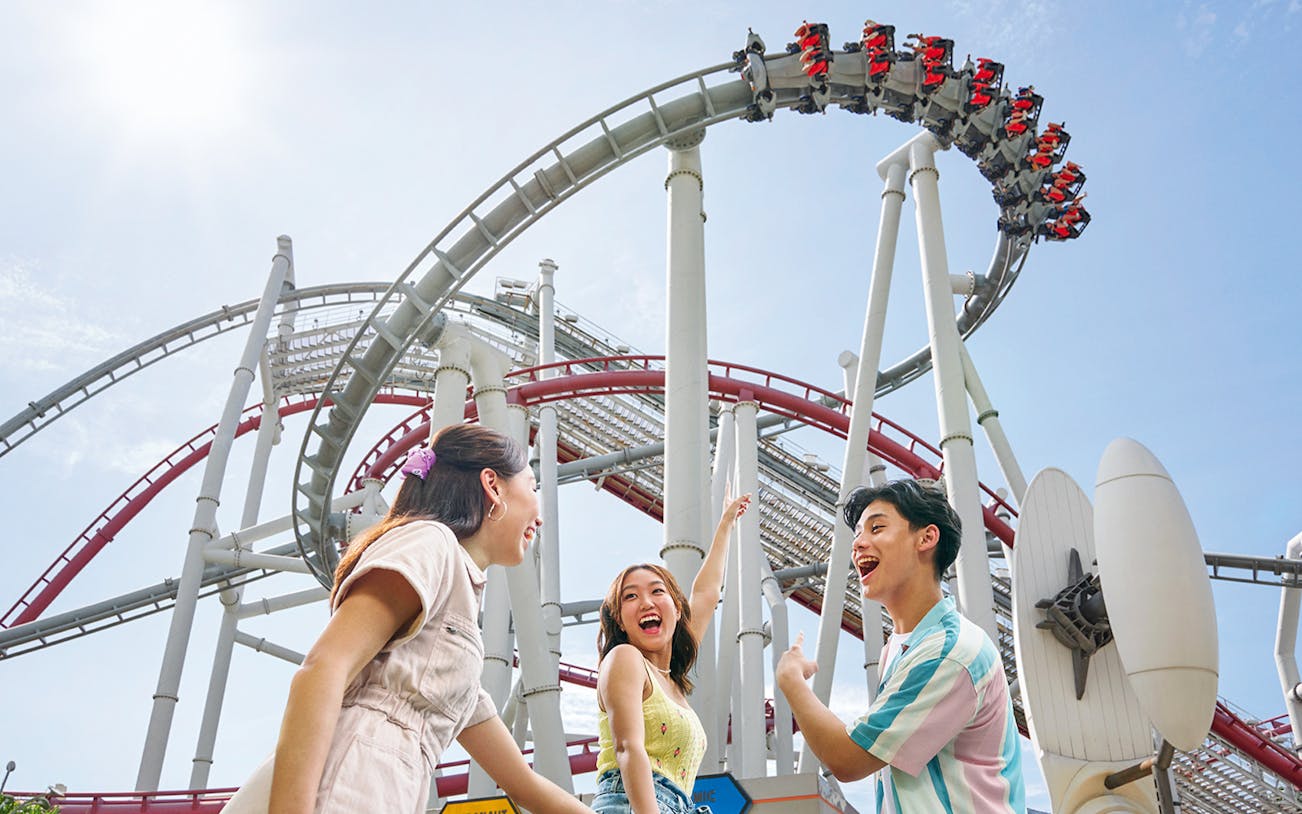 Family enjoying a roller coaster at Universal Studios Singapore.