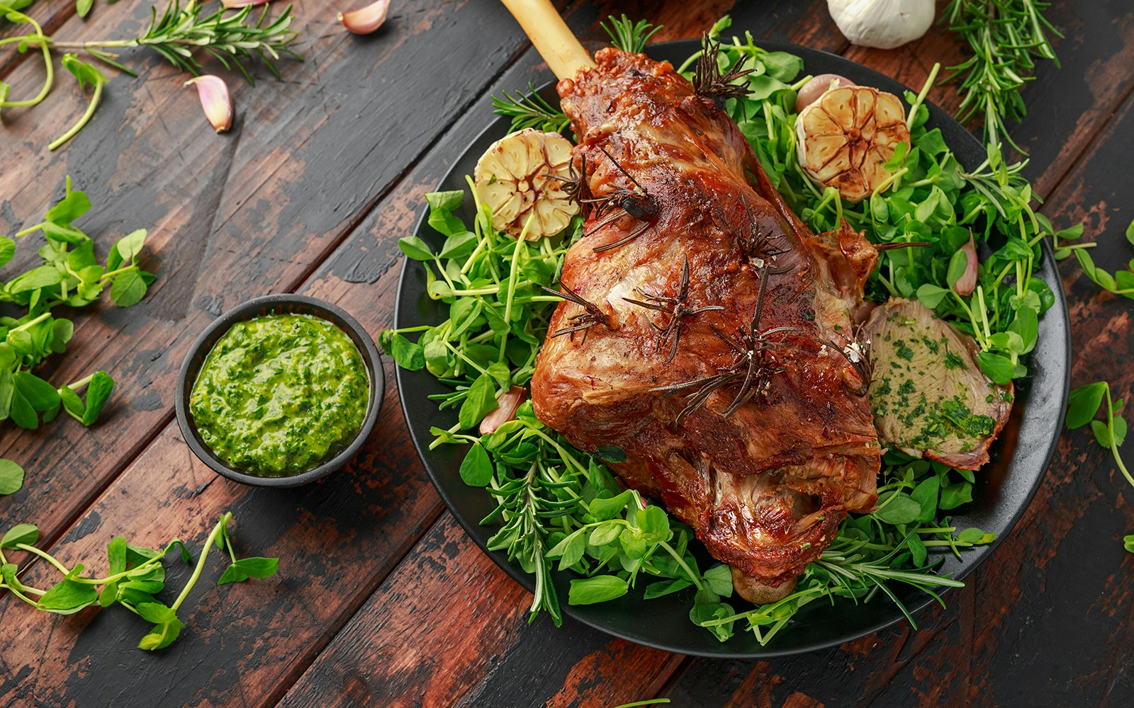 Roast Lamb leg with mint sauce, rosemary and garlic.