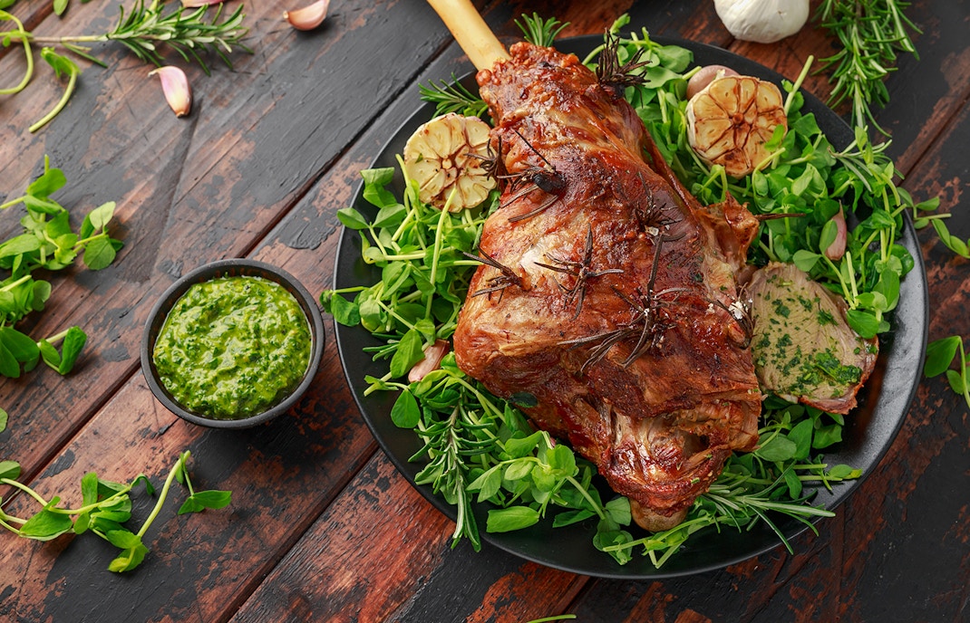 Roast Lamb leg with mint sauce, rosemary and garlic.