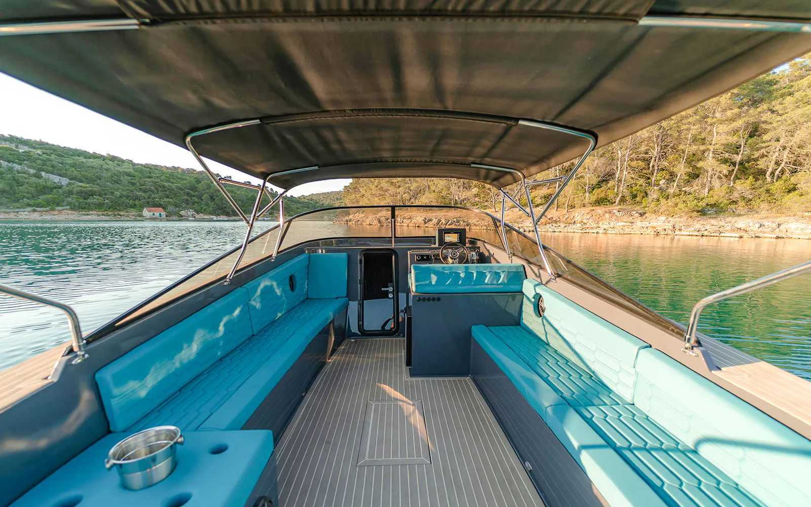 Luxury boat interior on Blue Lagoon tour with scenic coastal view.