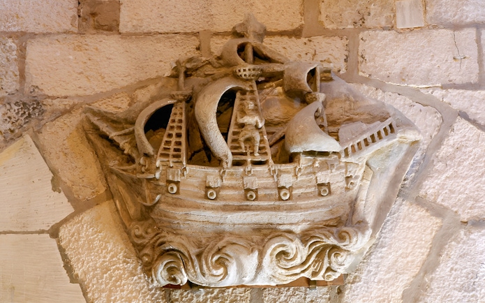 Stone carving of a ship inside the Towers of La Rochelle, France.
